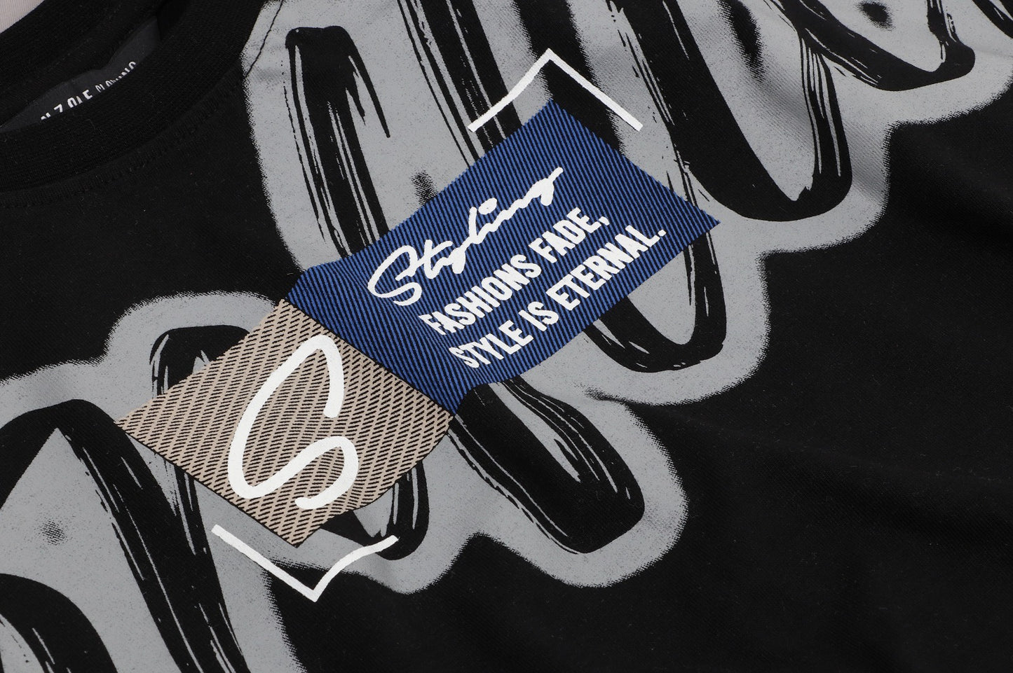 Black Tee With Oversized Graffiti-Style Script And “Style Is Eternal” Quote Patch