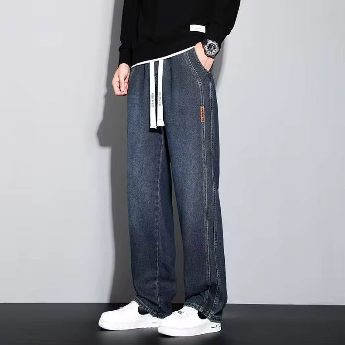 Light Wash Denim Joggers With Drawstring Waist And Tapered Cuffs