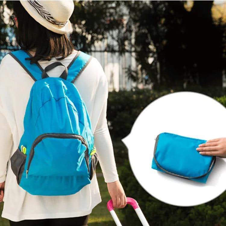 Person wearing a blue backpack with a close-up inset of a folded blue bag.