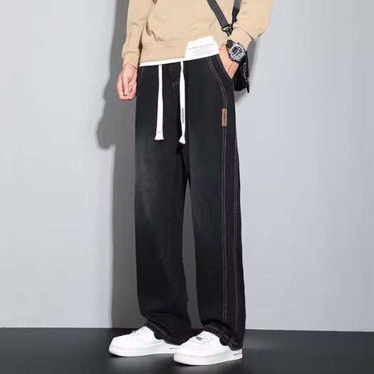 Light Wash Denim Joggers With Drawstring Waist And Tapered Cuffs